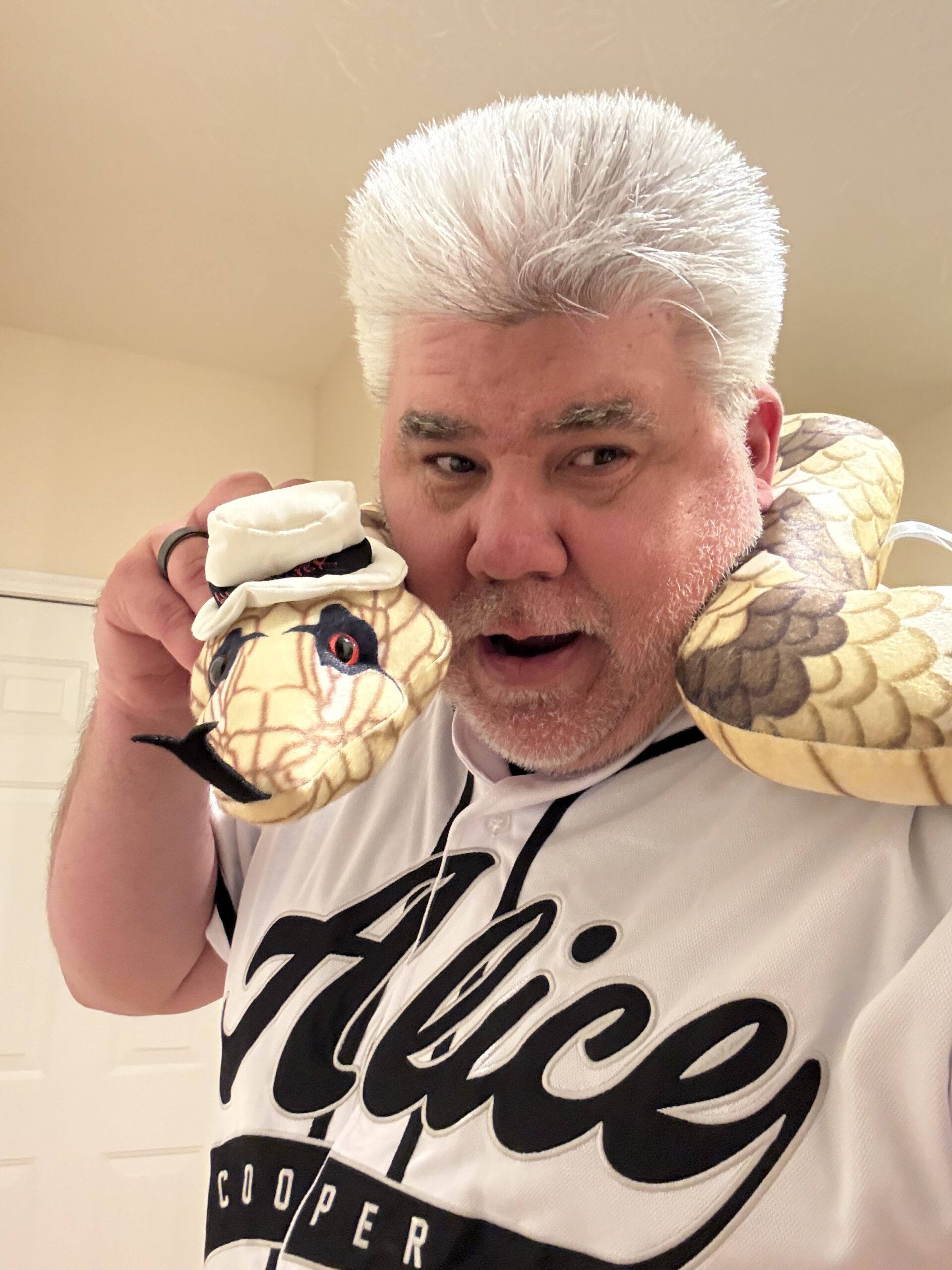 Concertgoer showing Alice Cooper merchandise at Rose Music Center in Dayton before the 2026 show
